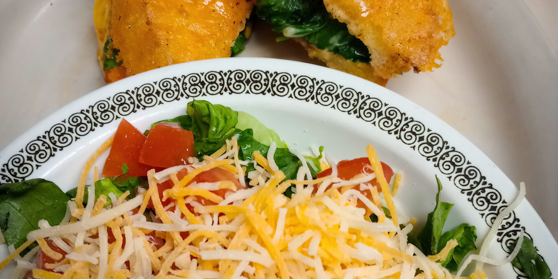 Deluxe grilled cheese sandwich and a side salad